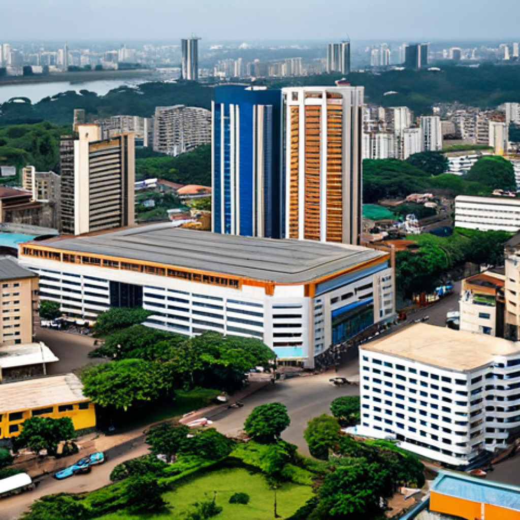코트디부아르 여행 안전 정보 - Abidjan Cityscape**

"A vibrant, daytime view of Abidjan, C&ocirc;te d'Ivoire, showcasing modern buildings...
