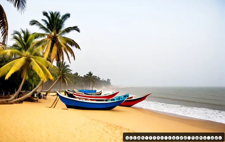 Home 17 코트디부아르 그랑바상 해변 - Photorealistic wide-angle view of Grand-Bassam beach, Côte d’Ivoire, gentle Atlantic waves meeting g...